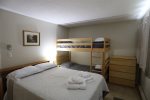 Main Bedroom with a Full Bed and a Bunk Bed in Waterville Valley Vacation Condo